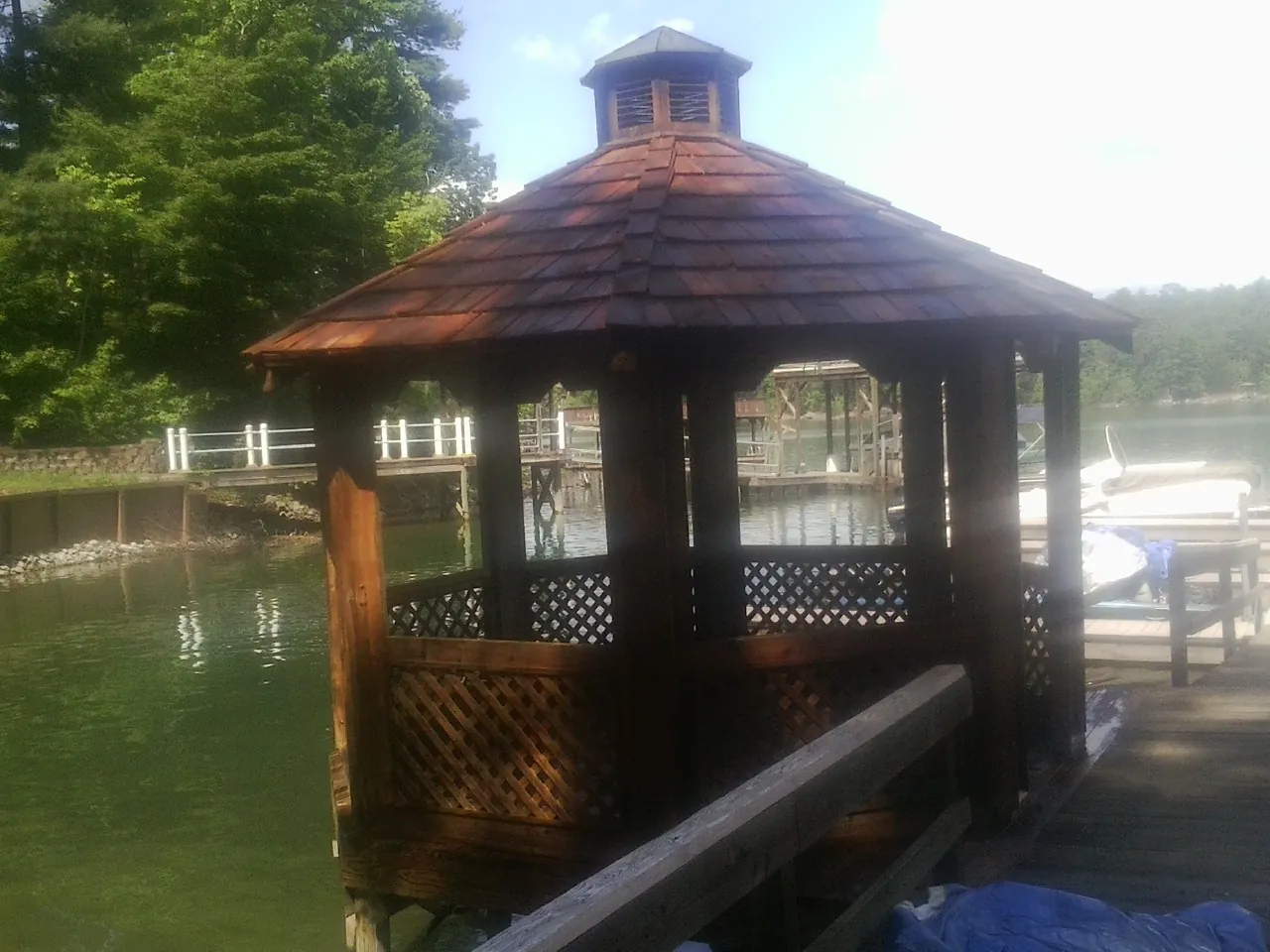 Cedar shake gazebo roof rebuilt on a lake dock in Ferdinand